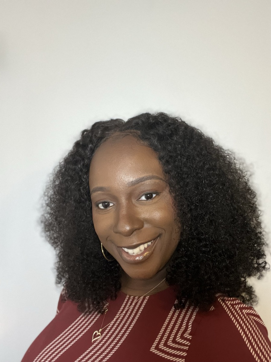 Jalessa Muschette, founder of JM Weddings & Events, smiling warmly.